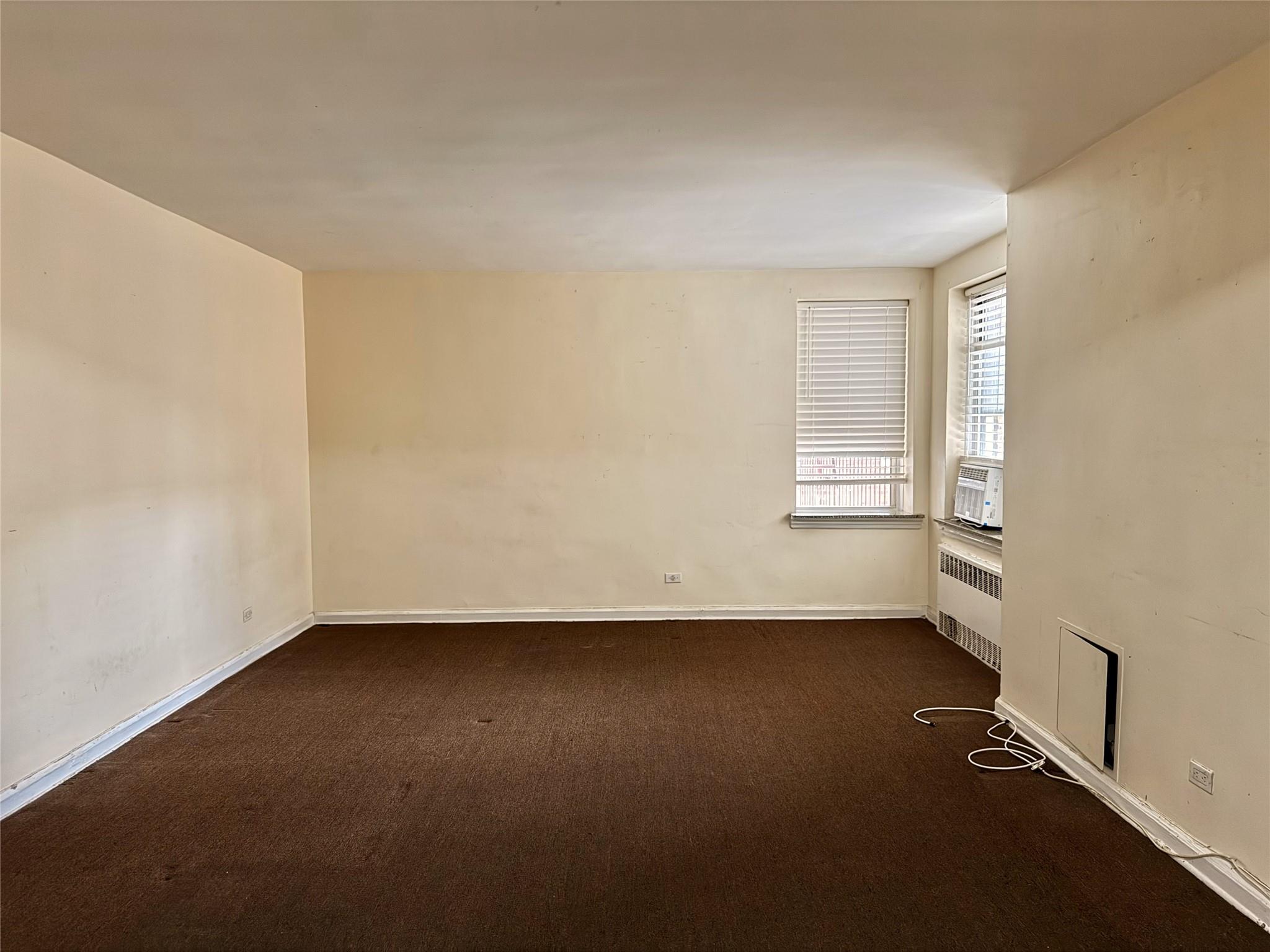 105-24 64th Road, Unit 4L Queens, NY 11375 - Photo 5 of 9 an empty room with a window