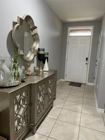 a bathroom with a sink a vanity and a mirror
