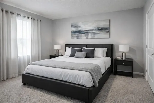 a bedroom with a bed and window