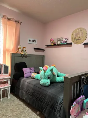 a bedroom with furniture and a potted plant