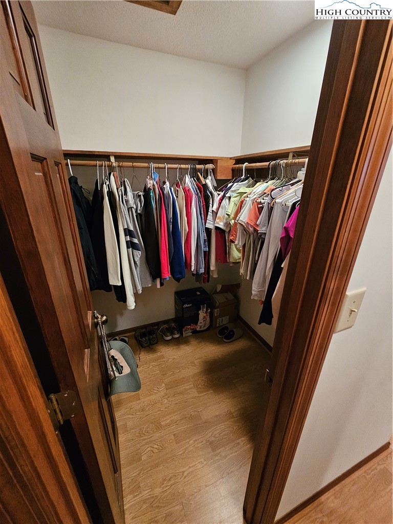 109 Foxgrape Hollow Road Beech Mountain, NC 28604 - Photo 13 of 50 a view of walk in closet with clothes