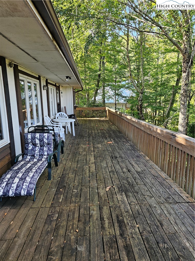 109 Foxgrape Hollow Road Beech Mountain, NC 28604 - Photo 36 of 50 a view of balcony with wooden floor and outdoor seating