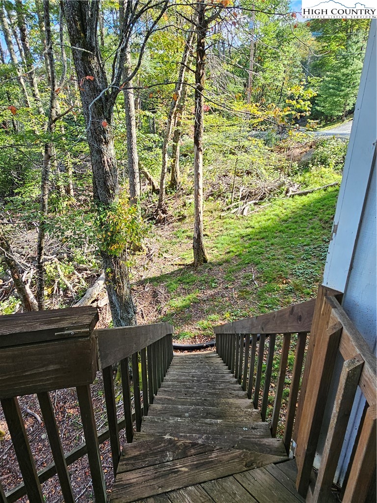 109 Foxgrape Hollow Road Beech Mountain, NC 28604 - Photo 40 of 50 a view of a balcony with wooden fence and floor
