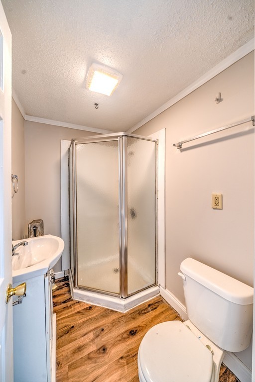 247-249 Commonwealth Avenue Springfield, MA 01108 - Photo 18 of 26 a bathroom with a sink toilet and shower