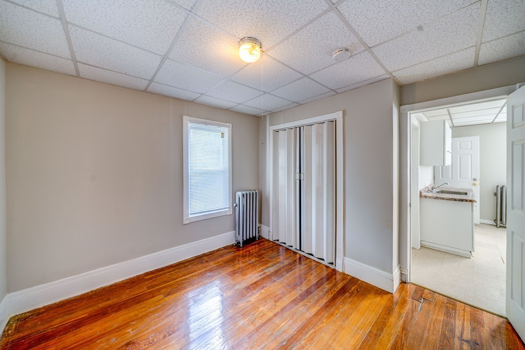 247-249 Commonwealth Avenue Springfield, MA 01108 - Photo 20 of 26 a view of empty room with wooden floor and fan