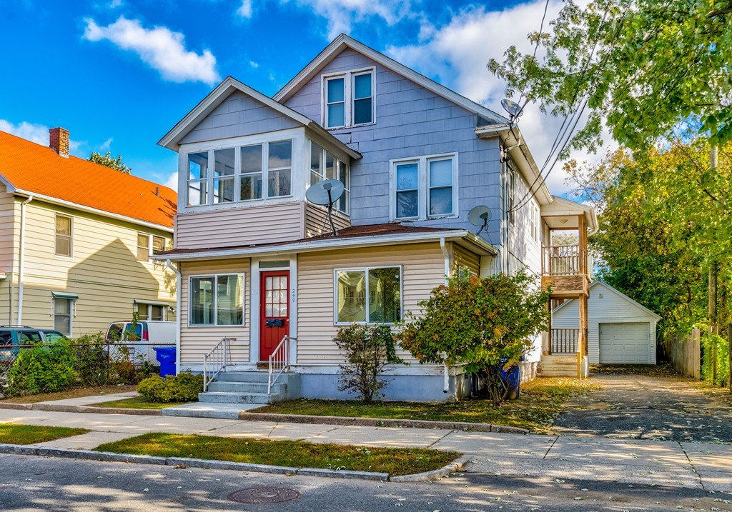 247-249 Commonwealth Avenue Springfield, MA 01108 - Photo 2 of 26 a view of a house with a yard and plants
