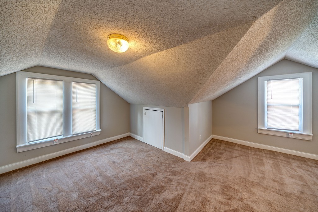 247-249 Commonwealth Avenue Springfield, MA 01108 - Photo 22 of 26 an empty room with windows and closet