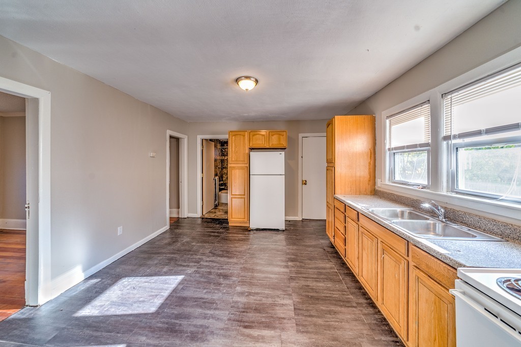 247-249 Commonwealth Avenue Springfield, MA 01108 - Photo 5 of 26 a view of a bathroom with sink and natural light