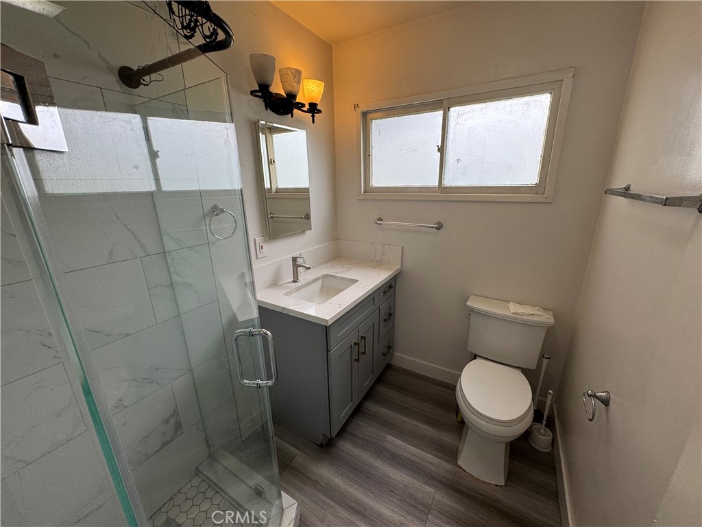 202 Spieth Way Riverside, CA 92507 - Photo 15 of 31 a bathroom with a toilet sink and mirror