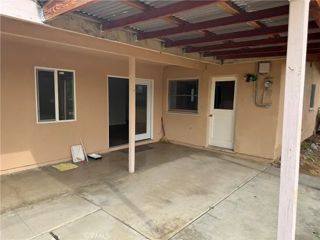 a view of a porch with seating space