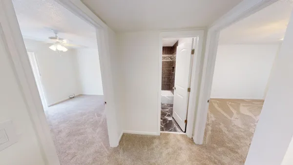 an empty room with an entryway door