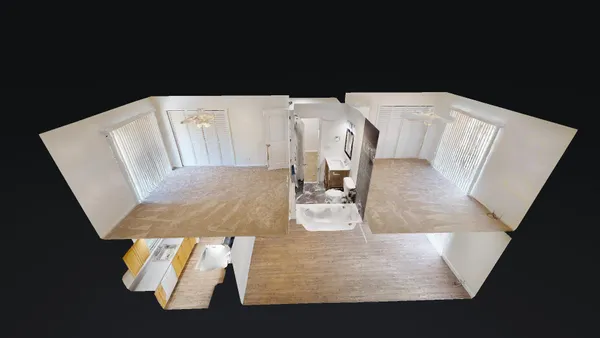 a view of living room with furniture and wooden floor