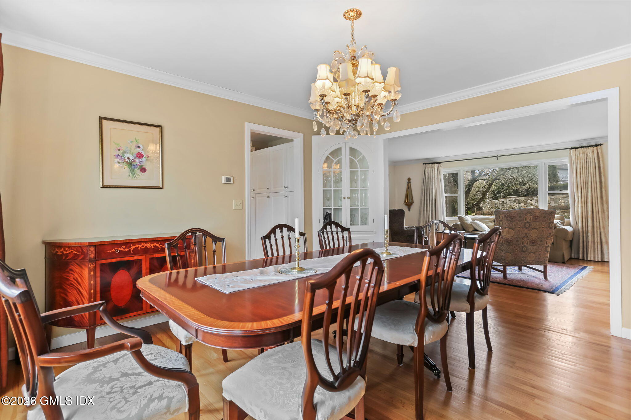 153 Lockwood Road Riverside, CT 06878 - Photo 12 of 58 a view of a dining room with furniture wooden floor and chandelier