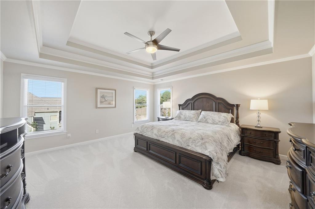 619 Blackwater Ridge Canton, GA 30114 - Photo 11 of 41 a spacious bedroom with a bed and a window