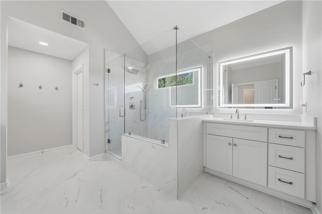 619 Blackwater Ridge Canton, GA 30114 - Photo 12 of 41 a bathroom with a shower sink and mirror