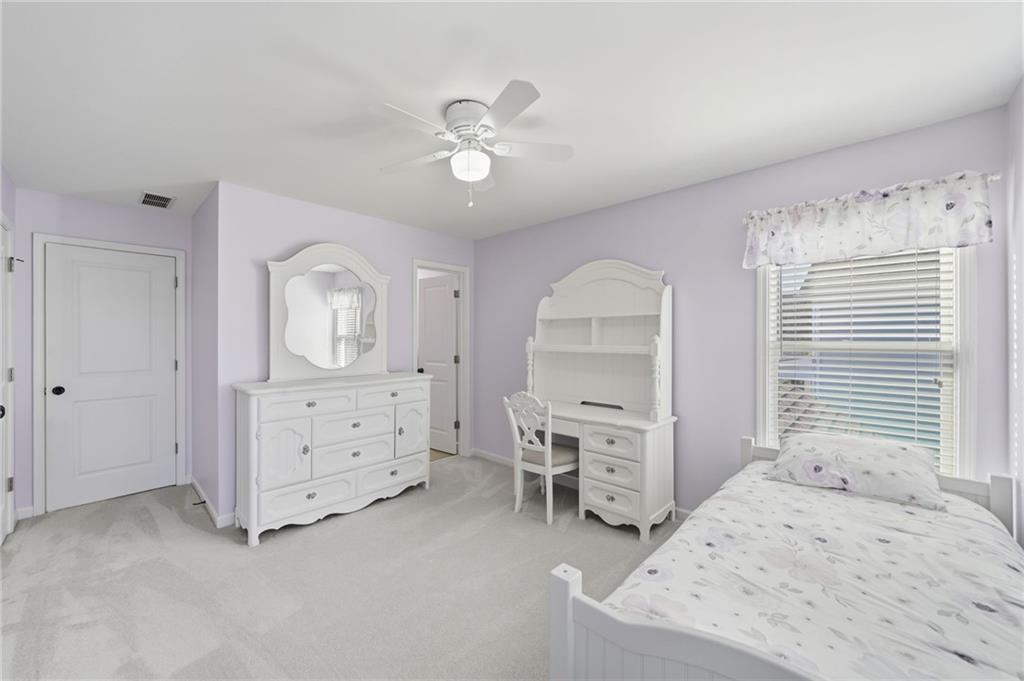 619 Blackwater Ridge Canton, GA 30114 - Photo 16 of 41 a view of a bedroom with furniture and windows