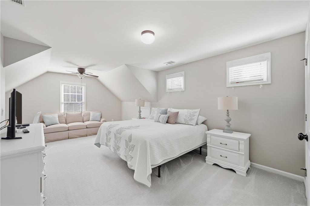 619 Blackwater Ridge Canton, GA 30114 - Photo 17 of 41 a bedroom with a bed and a couch