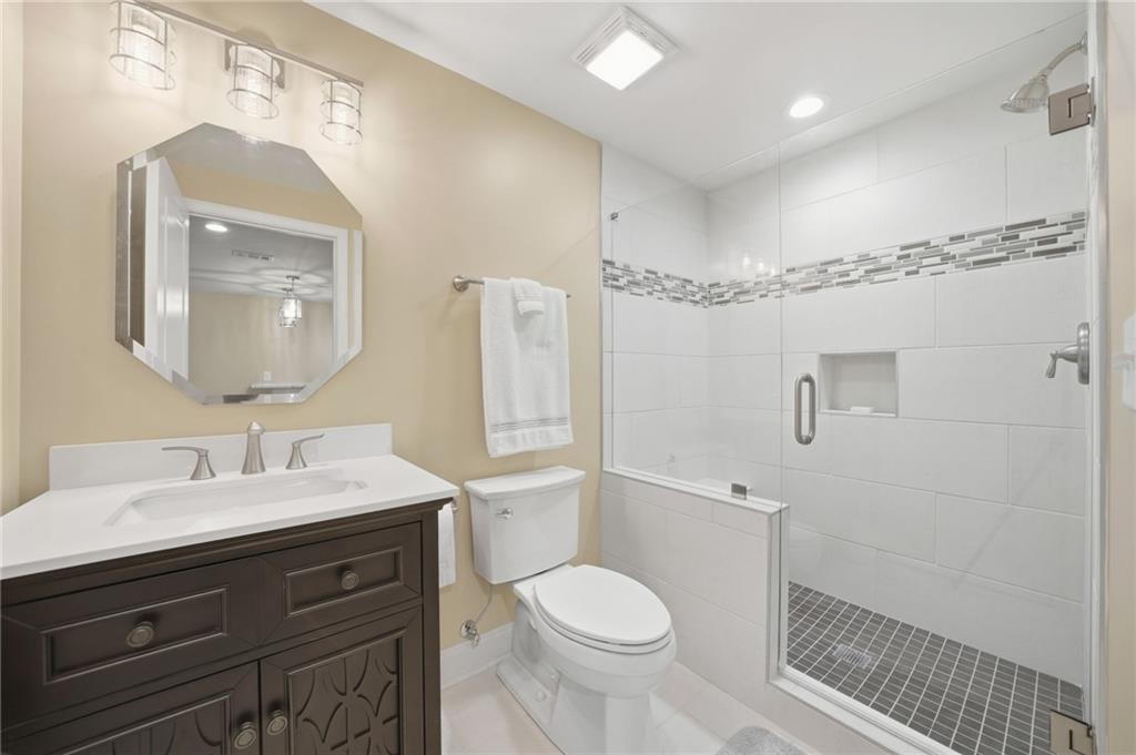 619 Blackwater Ridge Canton, GA 30114 - Photo 21 of 41 a bathroom with a sink a toilet and shower