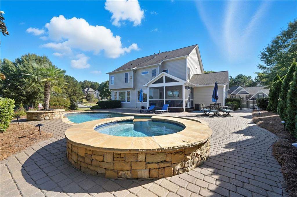 619 Blackwater Ridge Canton, GA 30114 - Photo 24 of 41 a view of a house with swimming pool and sitting area