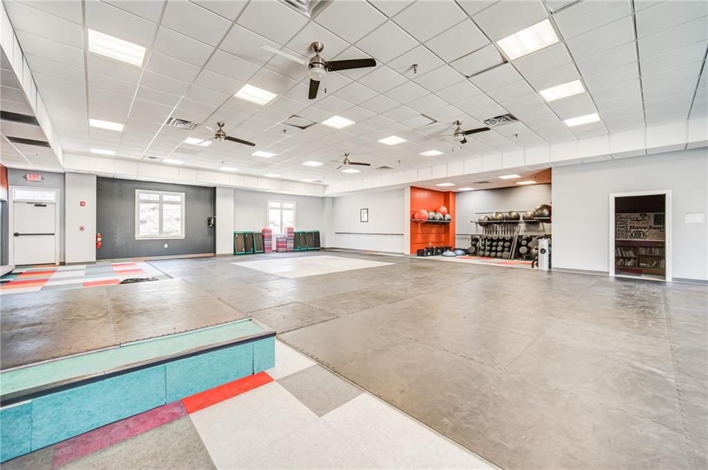 619 Blackwater Ridge Canton, GA 30114 - Photo 35 of 41 a living room with stainless steel appliances kitchen island lots of furniture and a kitchen view