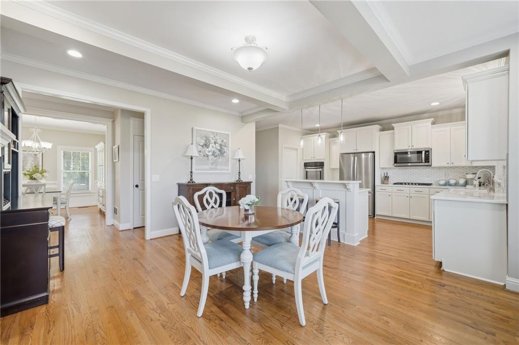 619 Blackwater Ridge Canton, GA 30114 - Photo 5 of 41 a dining room with furniture and kitchen view