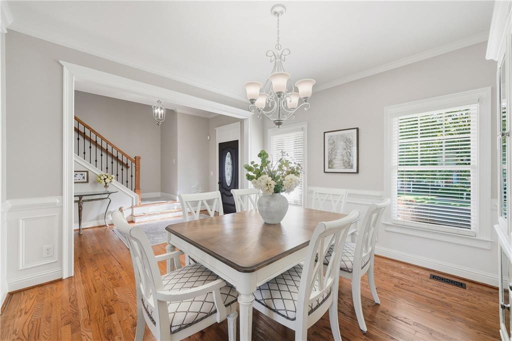 619 Blackwater Ridge Canton, GA 30114 - Photo 6 of 41 a view of a dining room with furniture and wooden floor
