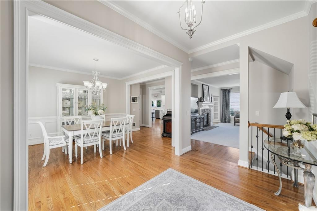 619 Blackwater Ridge Canton, GA 30114 - Photo 7 of 41 a view of a dining room with furniture wooden floor and chandelier