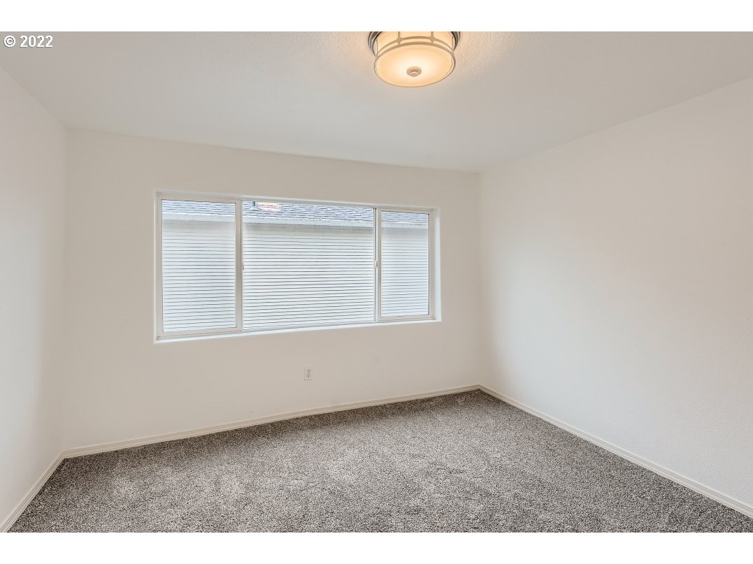 12603 Southeast Foster Road Portland, OR 97236 - Photo 21 of 28 an empty room with a window