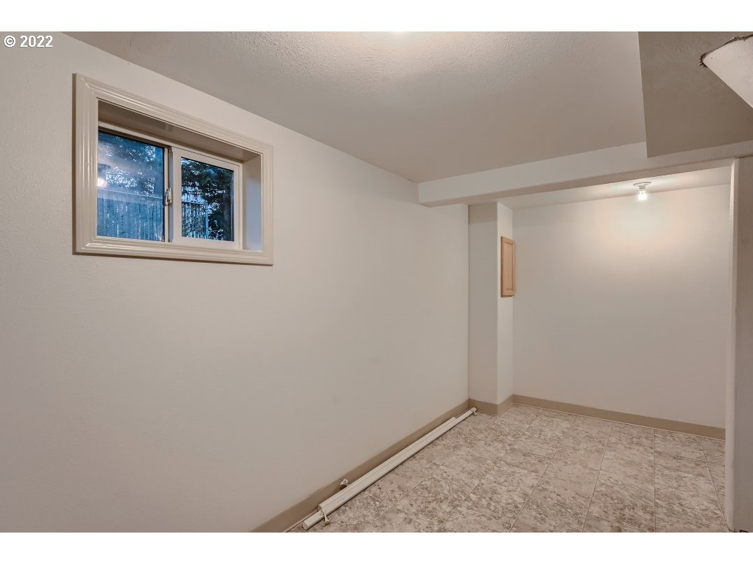 12603 Southeast Foster Road Portland, OR 97236 - Photo 26 of 28 a view of an empty room with a window