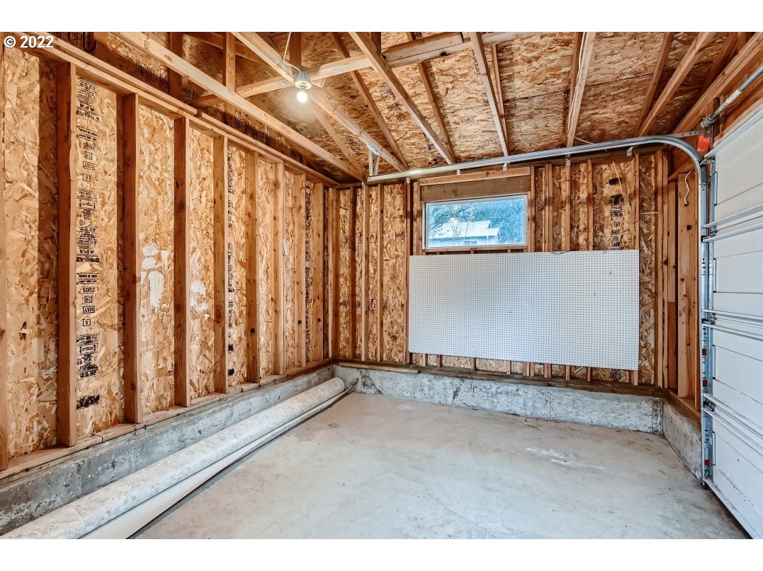 12603 Southeast Foster Road Portland, OR 97236 - Photo 27 of 28 a view of a garage with wooden walls
