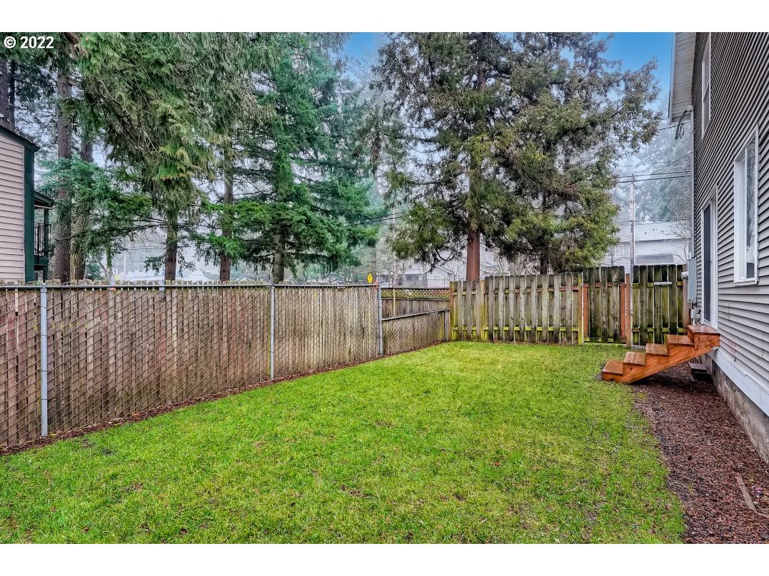 12603 Southeast Foster Road Portland, OR 97236 - Photo 28 of 28 a view of a backyard with wooden fence