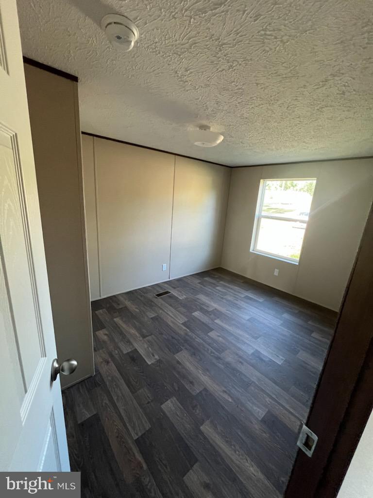 1555 Tavern Run Road Hague, VA 22469 - Photo 9 of 9 wooden floor in an empty room with a window