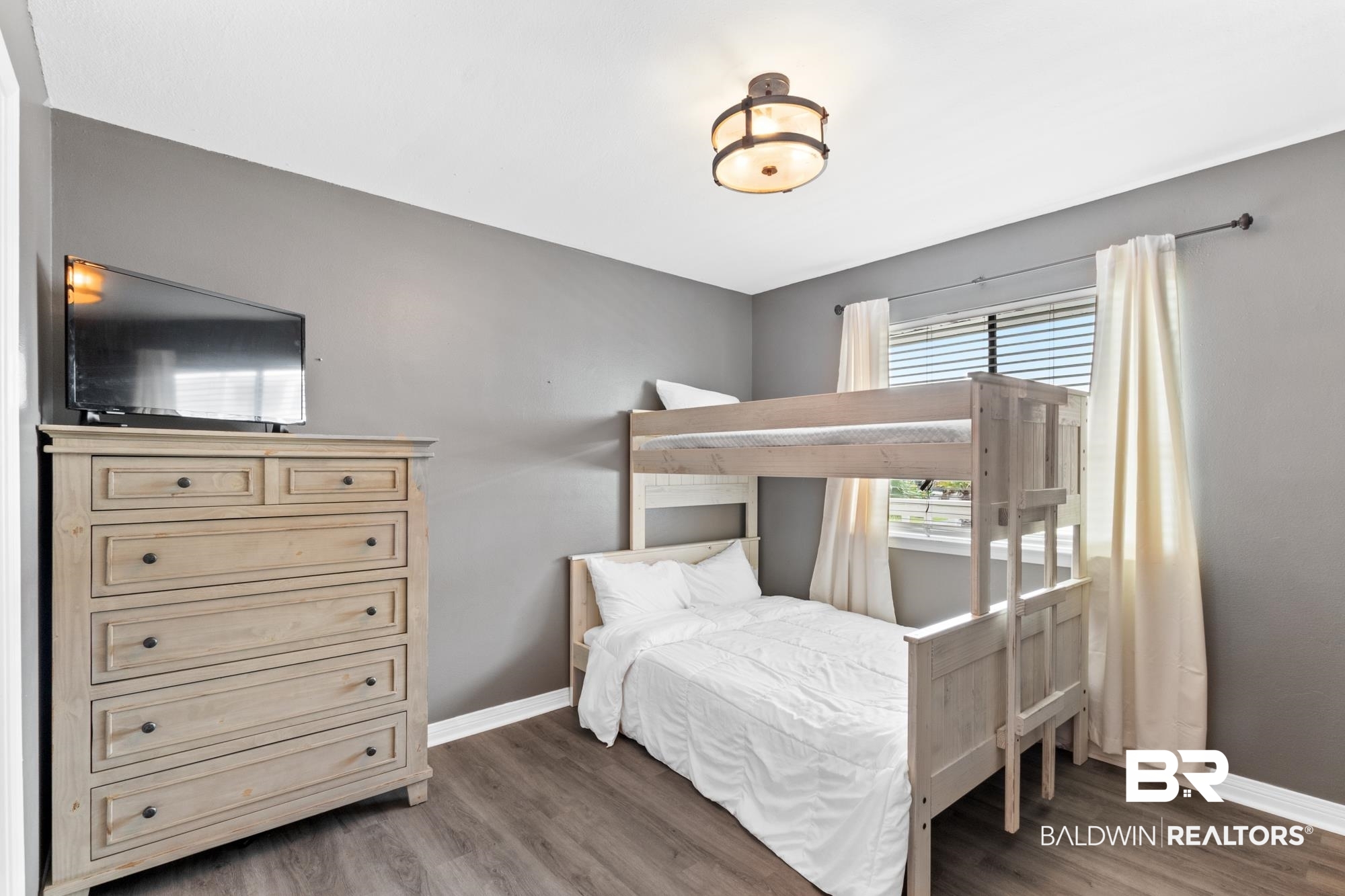 25925 -C Canal Road, Unit 203 Orange Beach, AL 36561 - Photo 14 of 57 Bedroom with dark hardwood / wood-style flooring