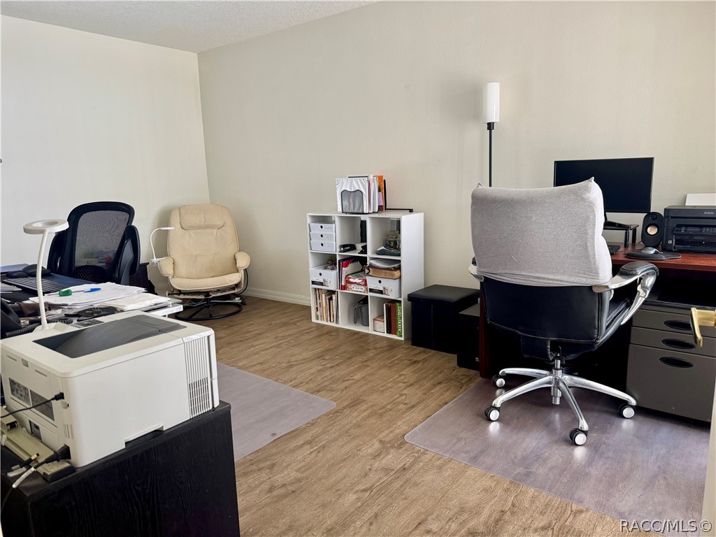 4588 East Van Ness Road Inverness, FL 34453 - Photo 26 of 34 a view of a workspace with furniture and a bathroom