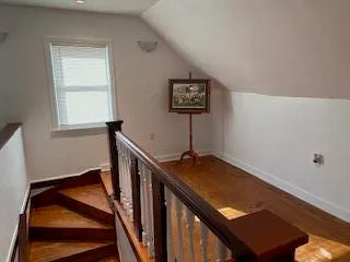 a view of a room with furniture and window