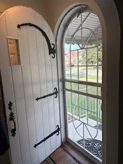 a view of an entryway with wooden floor