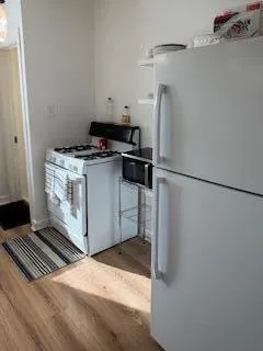 a kitchen with a stove and a refrigerator