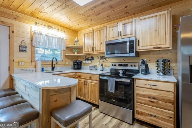 a view of a balcony with wooden floor and furniture