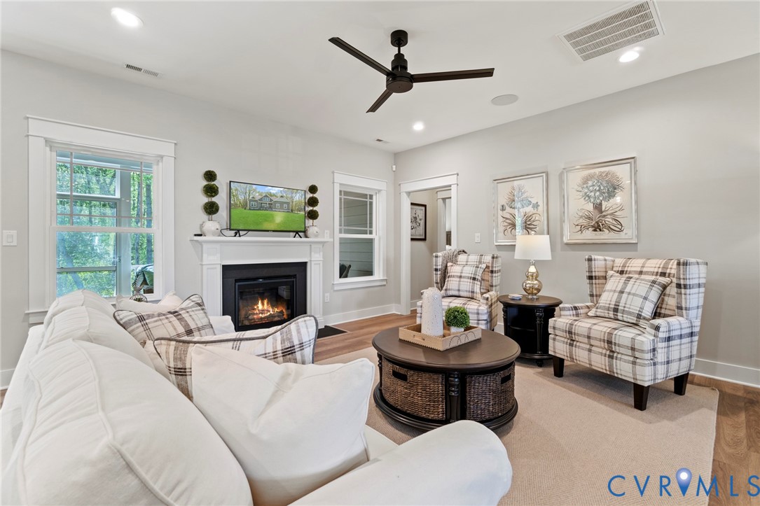 2111 Darbytown Road Henrico, VA 23231 - Photo 15 of 23 Living area featuring a fireplace with a white man