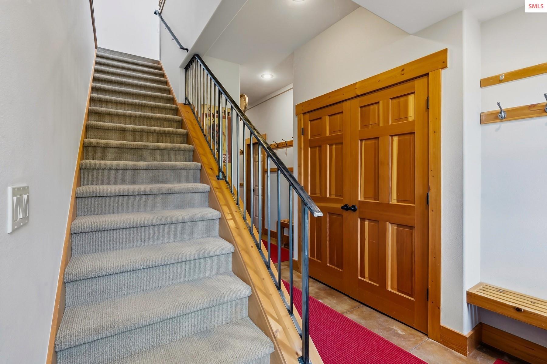 8 Snowghost Road Sandpoint, ID 83864 - Photo 15 of 34 The large stair case offers easy access to the upper level