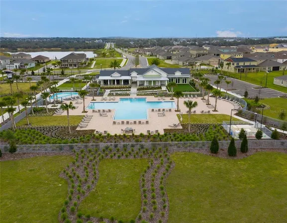 a view of a lake with a table and chairs