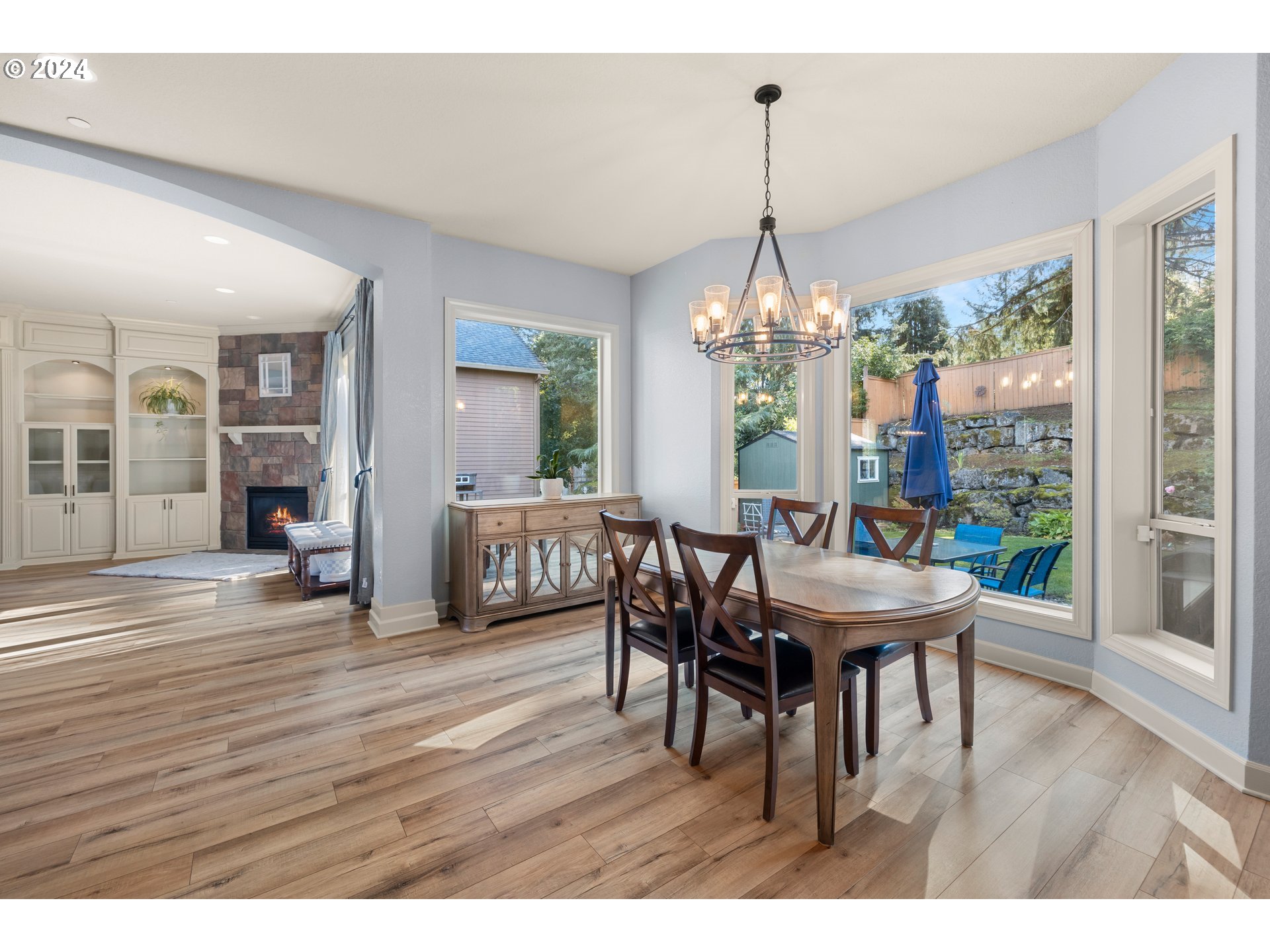 606 Northwest 24th Circle Camas, WA 98607 - Photo 11 of 48 a dining room with furniture wooden floor a chandelier and a rug