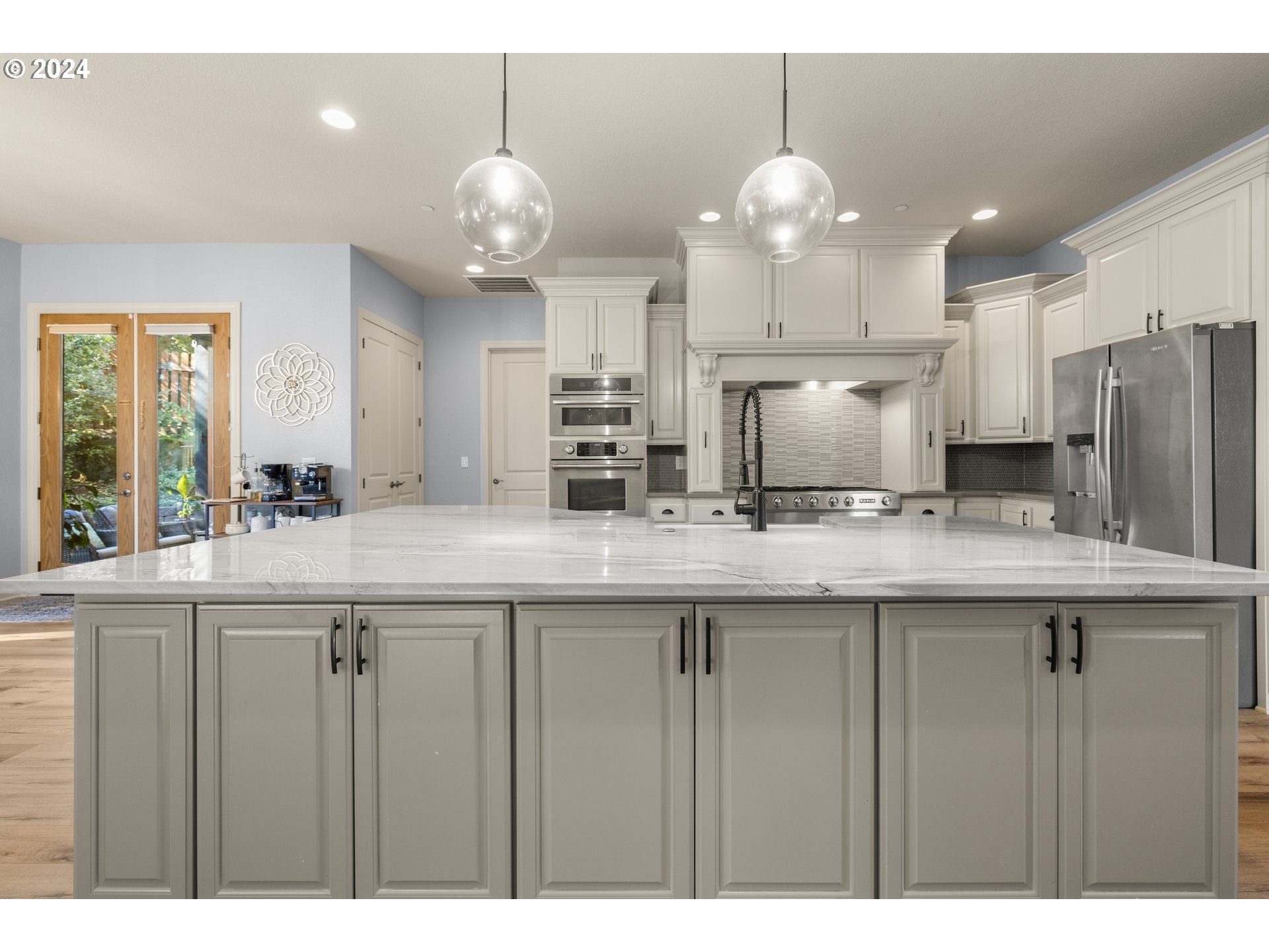 606 Northwest 24th Circle Camas, WA 98607 - Photo 14 of 48 a kitchen with granite countertop a sink cabinets and stainless steel appliances