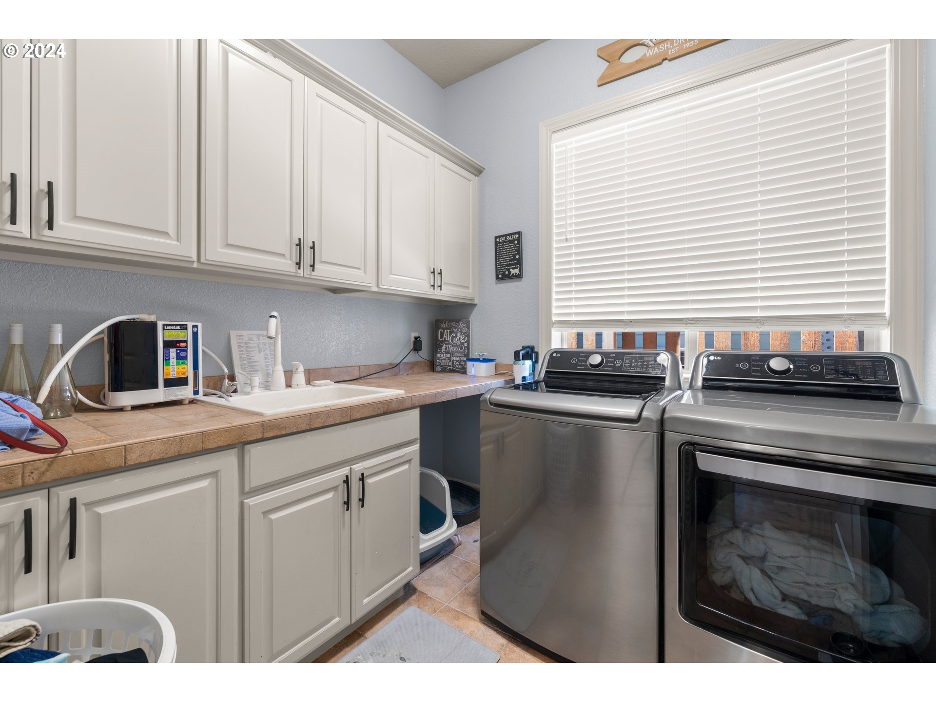 606 Northwest 24th Circle Camas, WA 98607 - Photo 18 of 48 a kitchen with cabinets appliances a sink and a window