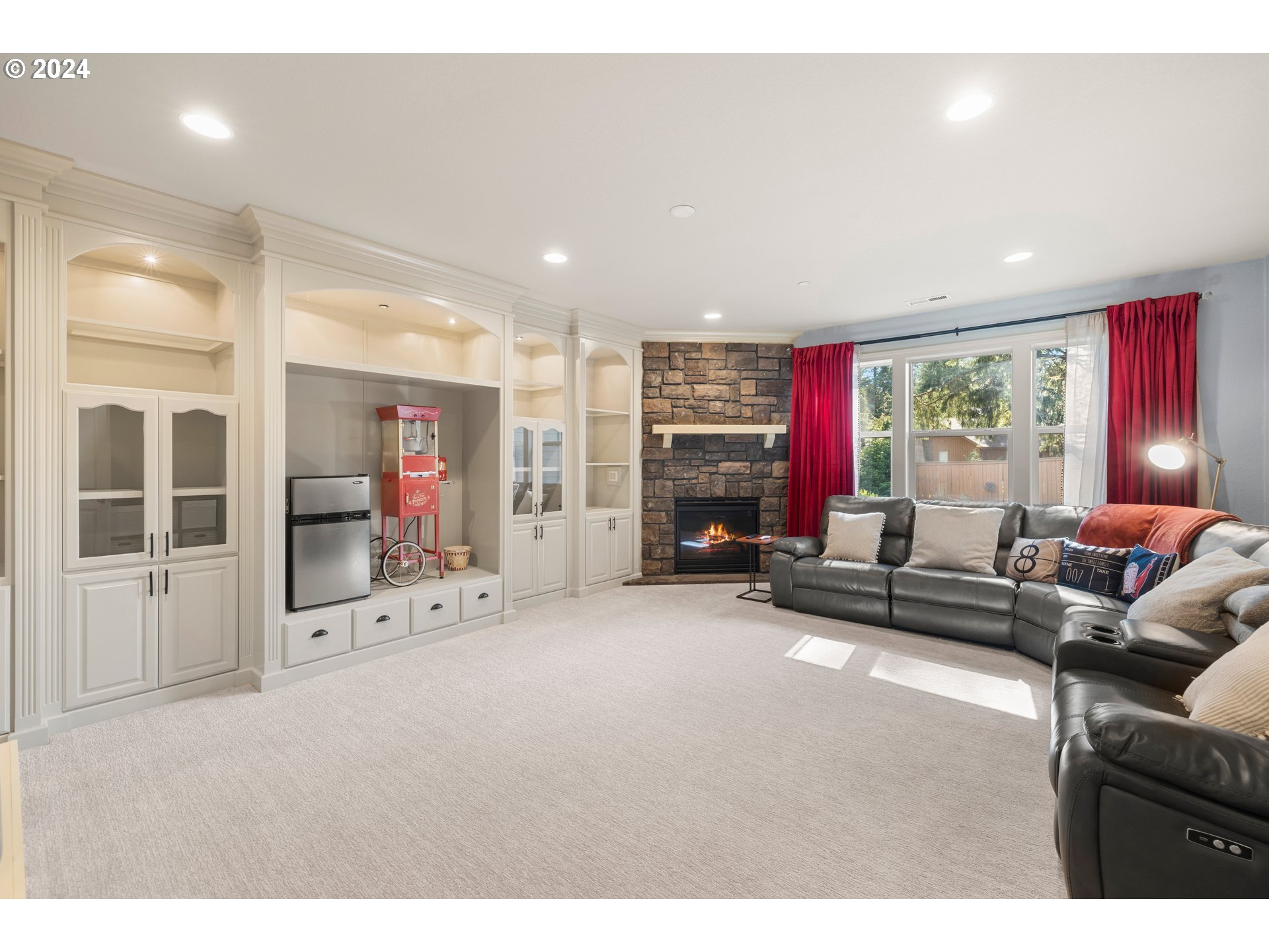 606 Northwest 24th Circle Camas, WA 98607 - Photo 22 of 48 a living room with furniture a flat screen tv and a large window