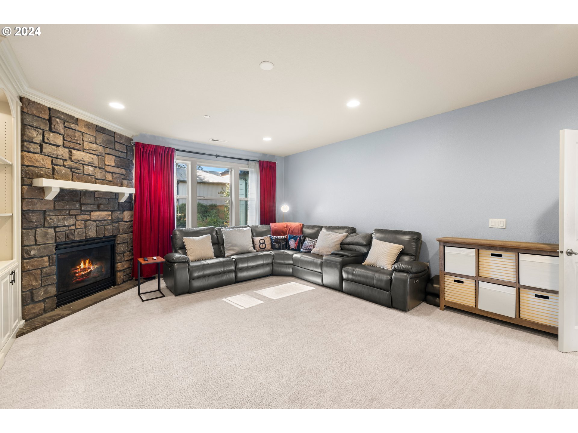 606 Northwest 24th Circle Camas, WA 98607 - Photo 23 of 48 a living room with furniture a flat screen tv and a fireplace
