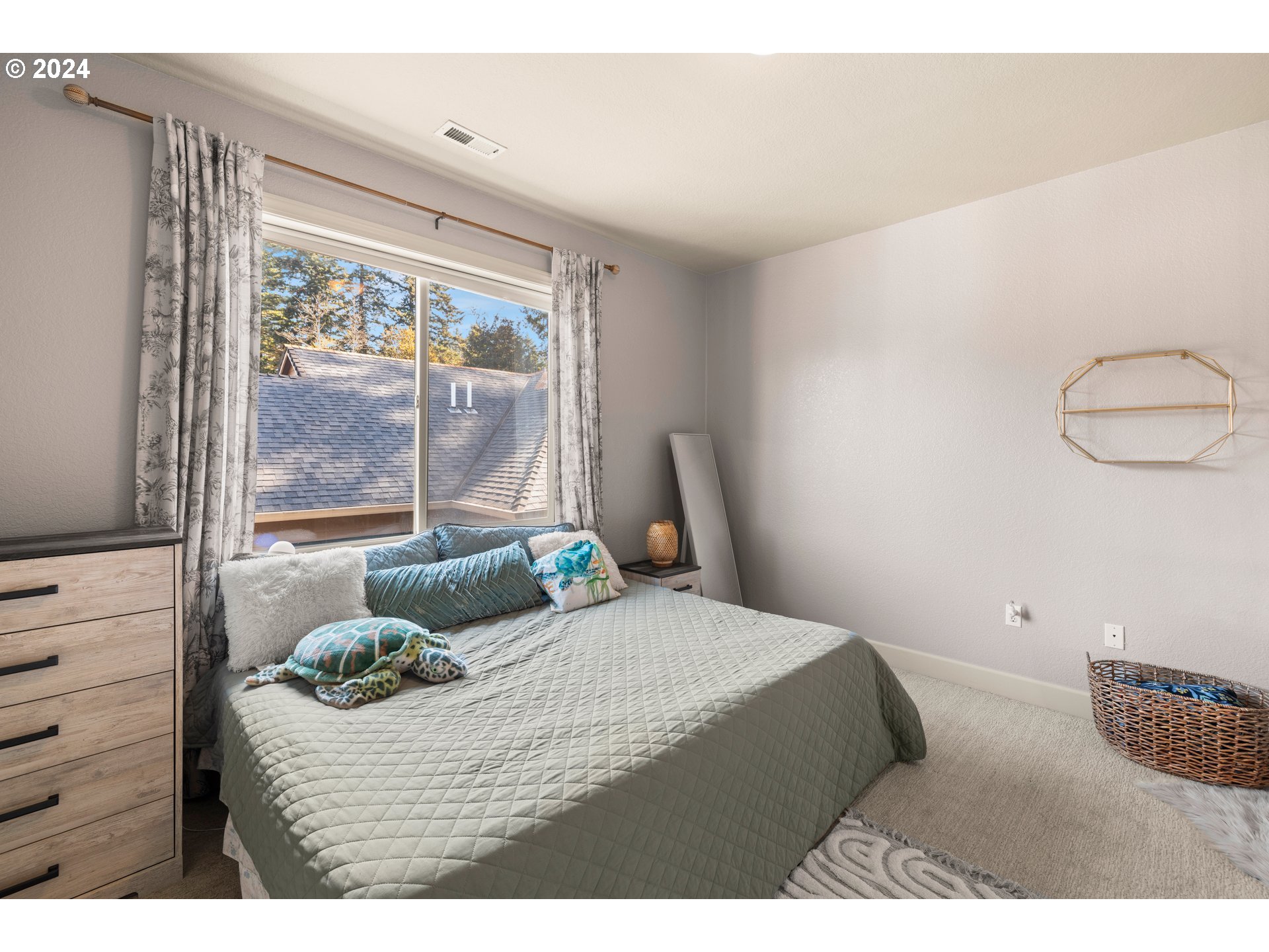 606 Northwest 24th Circle Camas, WA 98607 - Photo 26 of 48 a bedroom with a bed and window