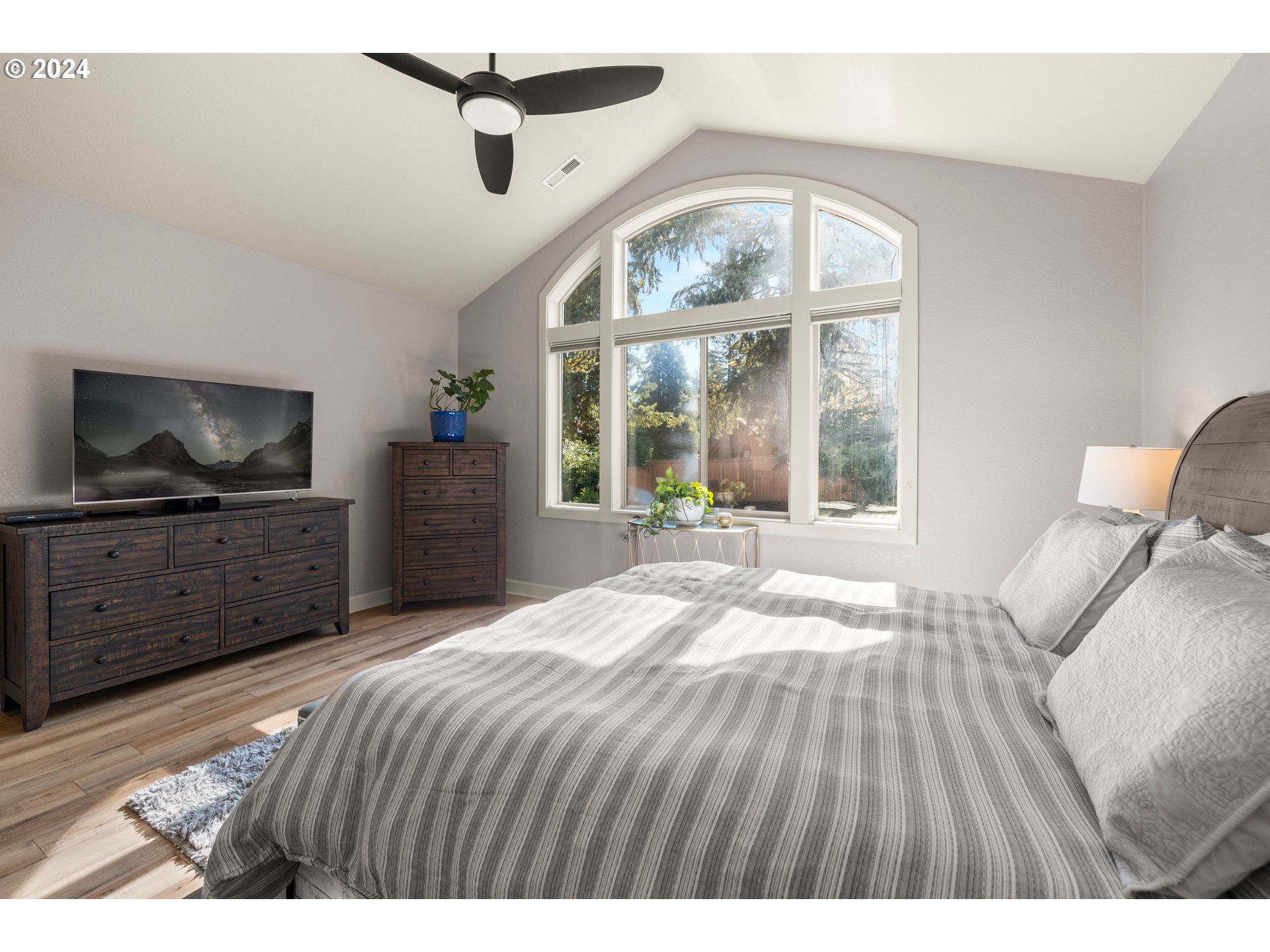 606 Northwest 24th Circle Camas, WA 98607 - Photo 28 of 48 a bedroom with a bed and a flat screen tv