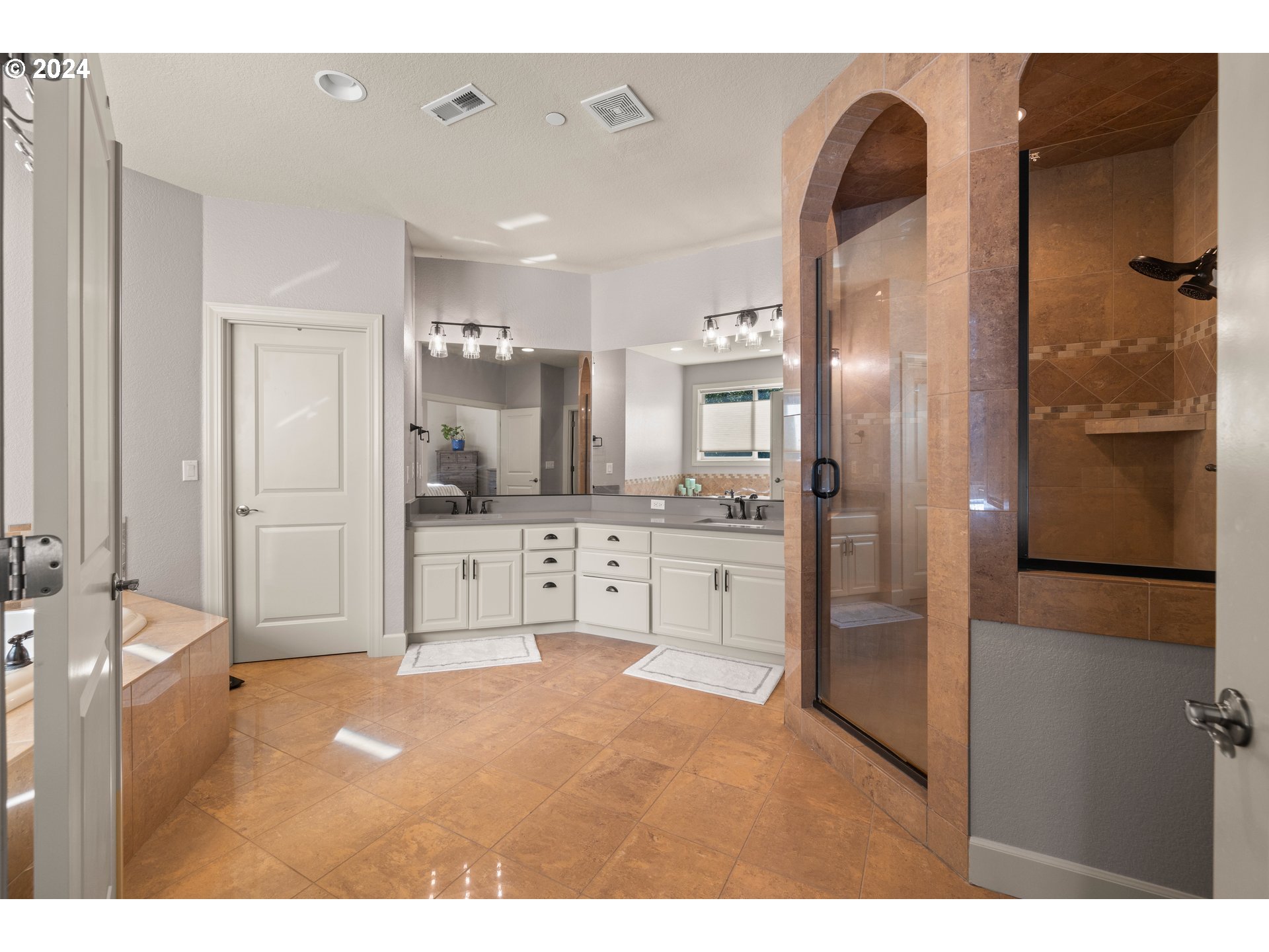606 Northwest 24th Circle Camas, WA 98607 - Photo 29 of 48 a bathroom with a shower sink and mirror