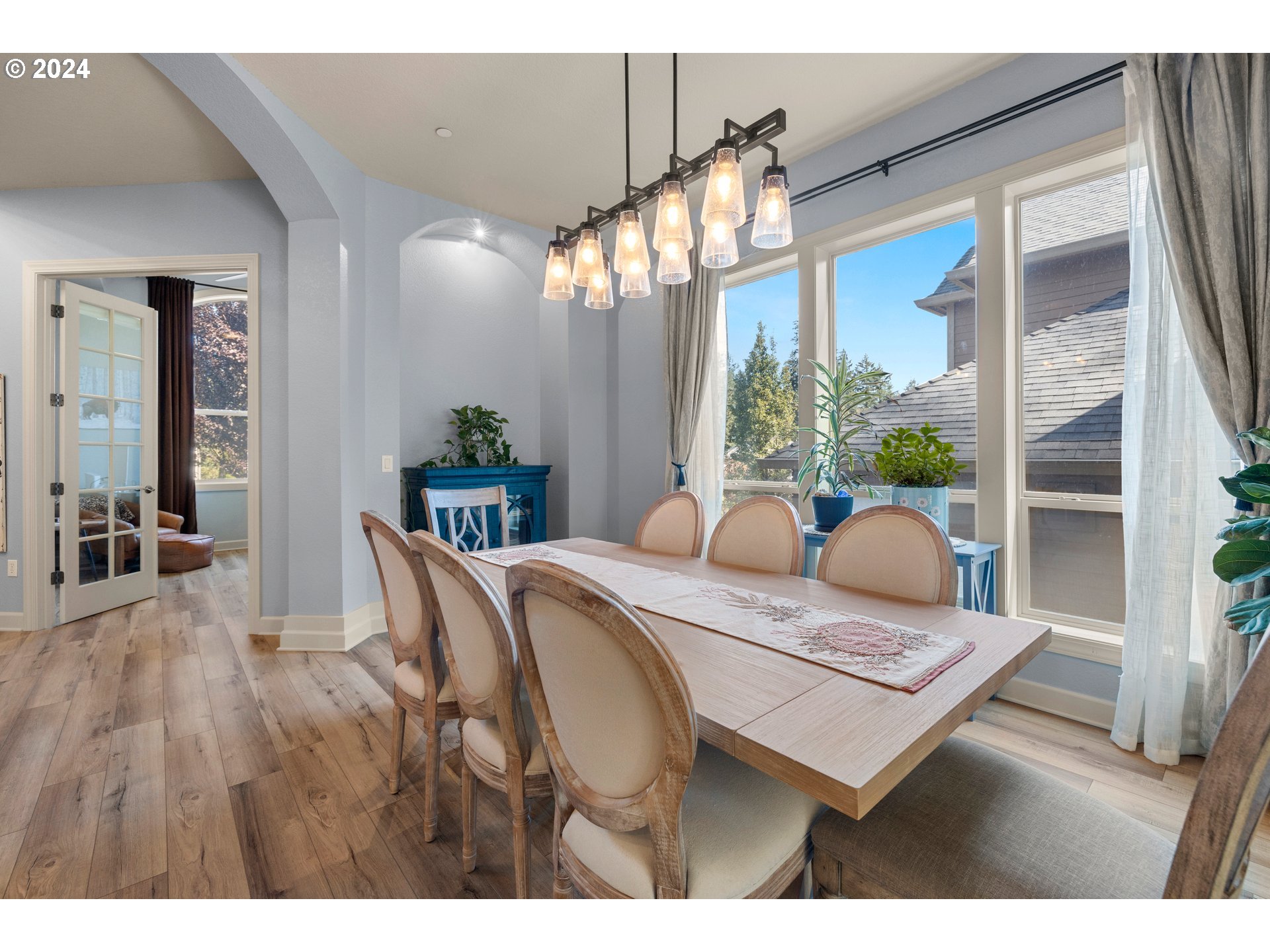 606 Northwest 24th Circle Camas, WA 98607 - Photo 6 of 48 a view of a dining room with furniture window and wooden floor